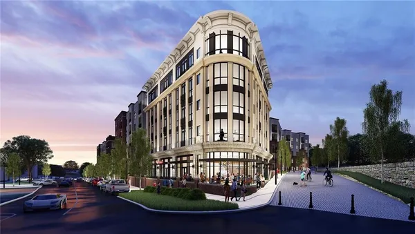 a view of a brick building next to a yard