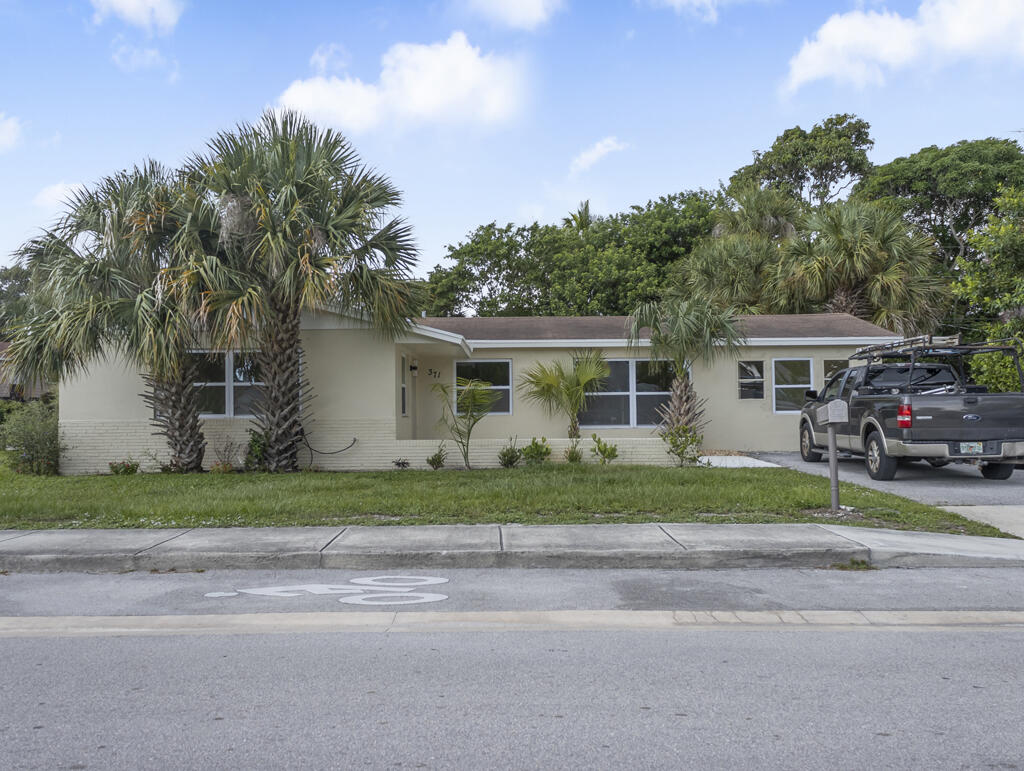 371 West 34th Street Riviera Beach, FL 33404 - Photo 2 of 27 Front