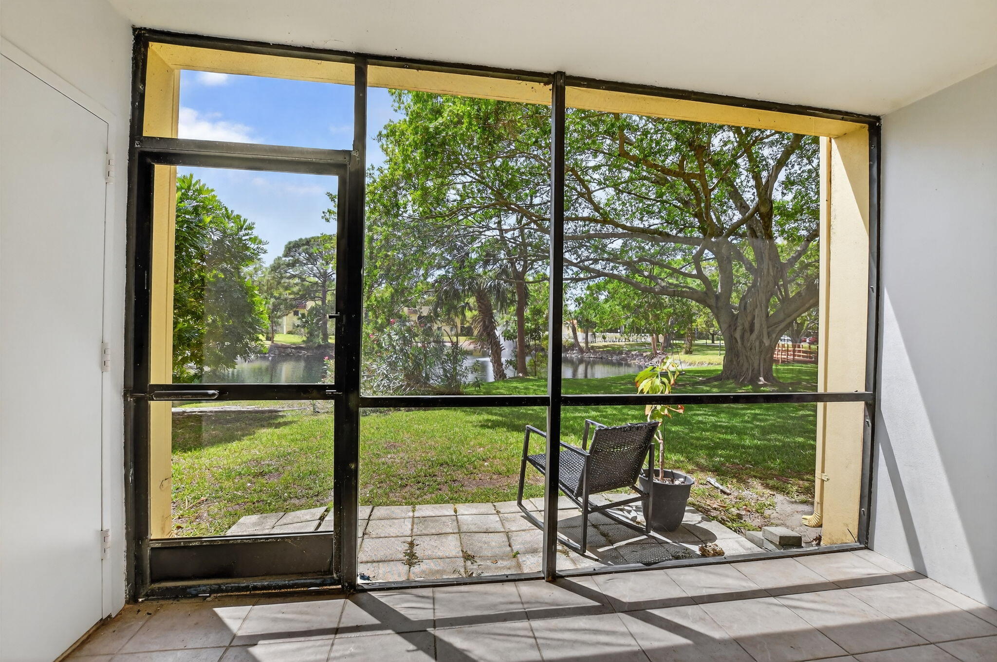918 Southwest 9th St Circle, Unit 105 Boca Raton, FL 33486 - Photo 25 of 39 a view of a porch with a yard