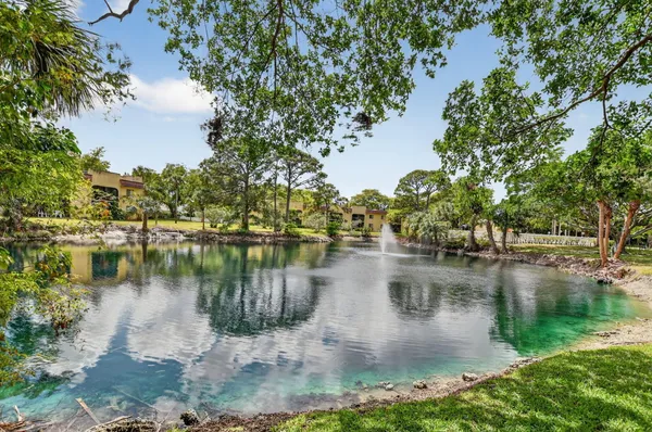 an aerial view of a house with a lake view