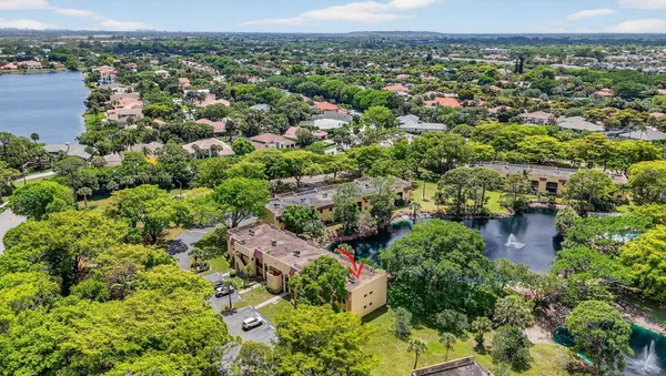 an aerial view of house with yard swimming pool and outdoor seating