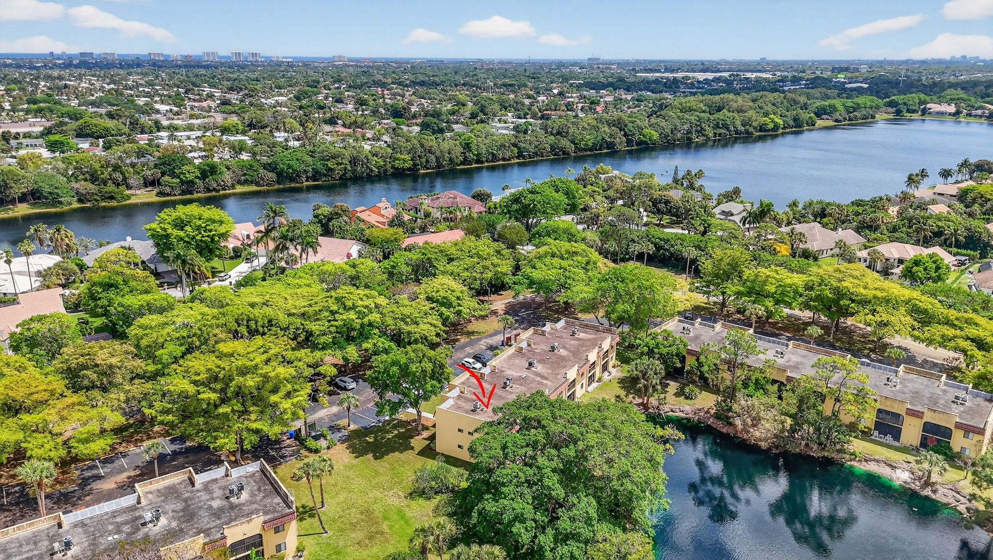 918 Southwest 9th St Circle, Unit 105 Boca Raton, FL 33486 - Photo 34 of 39 an aerial view of residential houses with outdoor space and lake view