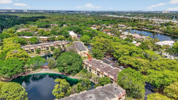an aerial view of a house with swimming pool and outdoor space