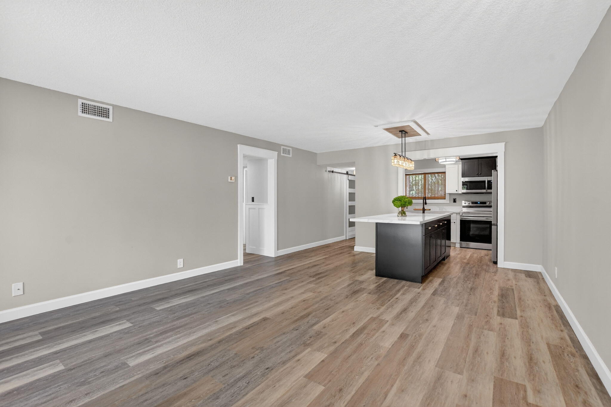 918 Southwest 9th St Circle, Unit 105 Boca Raton, FL 33486 - Photo 8 of 39 a kitchen with stainless steel appliances a refrigerator and a stove top oven