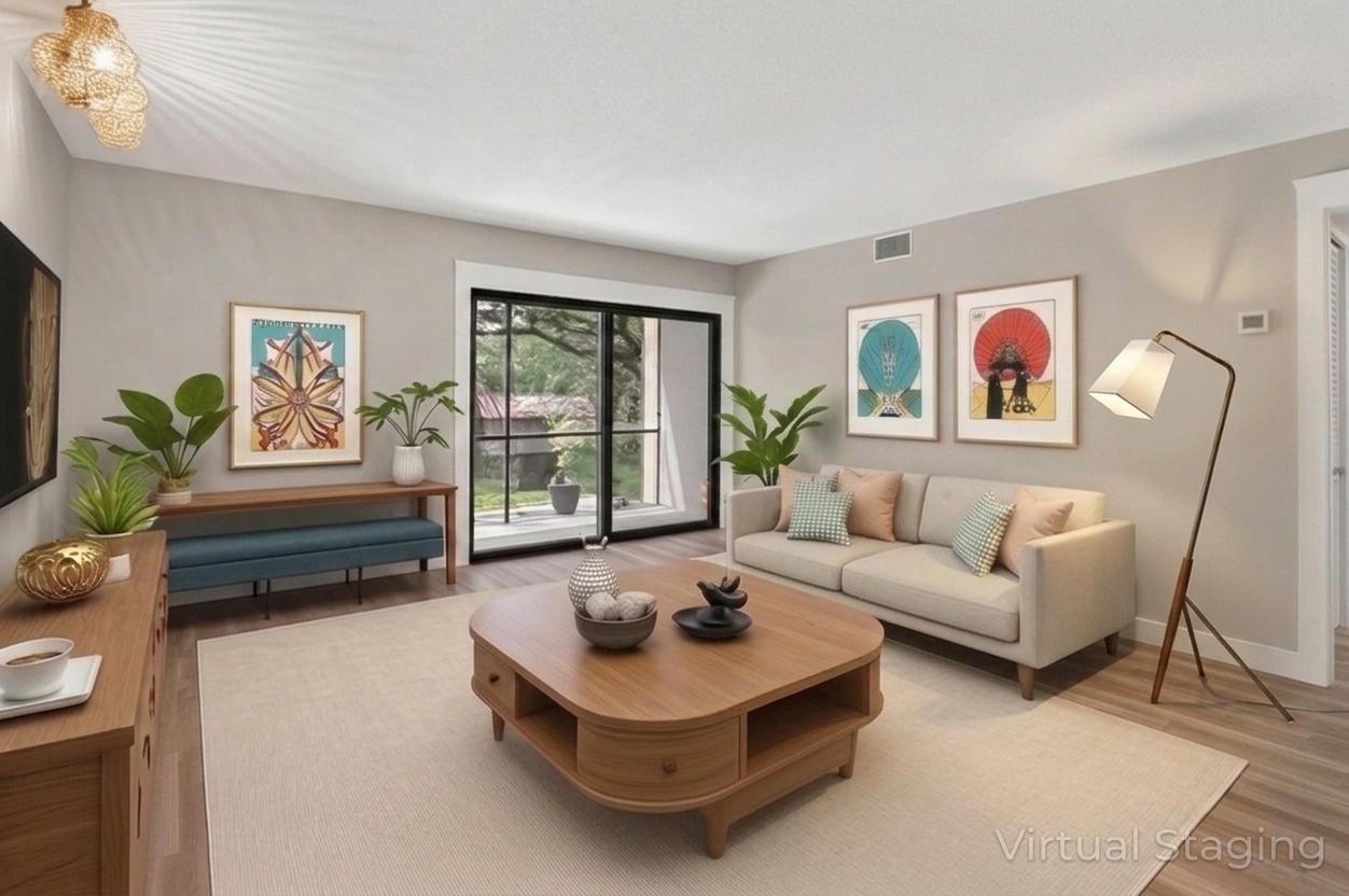 918 Southwest 9th St Circle, Unit 105 Boca Raton, FL 33486 - Photo 10 of 39 a living room with furniture and a potted plant