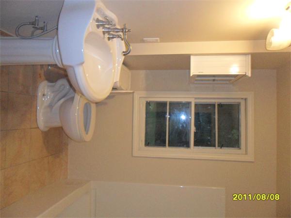 99 Mayher Street Springfield, MA 01104 - Photo 10 of 10 a bathroom with a mirror and a shower