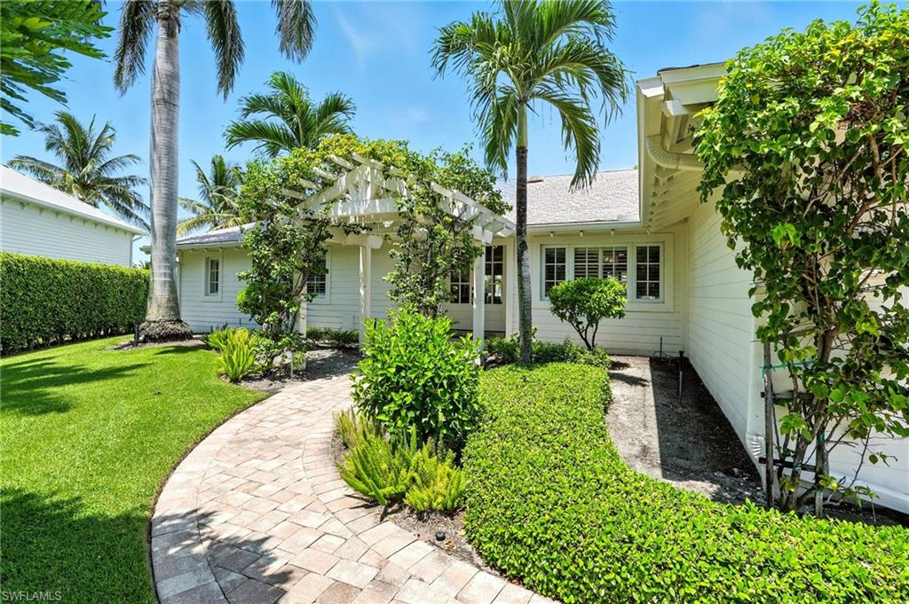 205 Springline Drive Naples, FL 34102 - Photo 25 of 26 a view of a yard in front of house