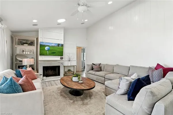 a living room with furniture and a fireplace