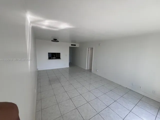 an empty room with white walls