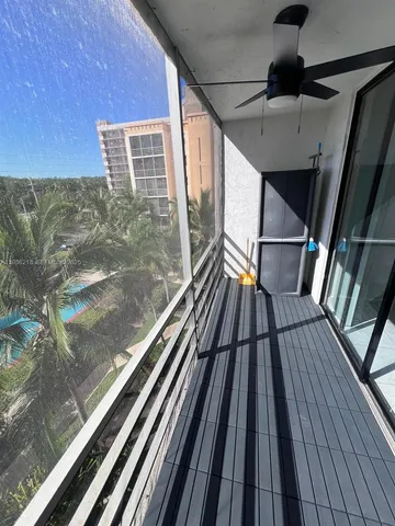 a view of balcony with wooden floor