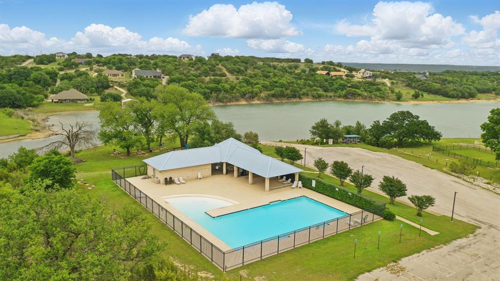 475 Overlook Ridge Bluff Dale, TX 76433 - Photo 19 of 27 a view of a big room with a big yard and potted plants and large tree