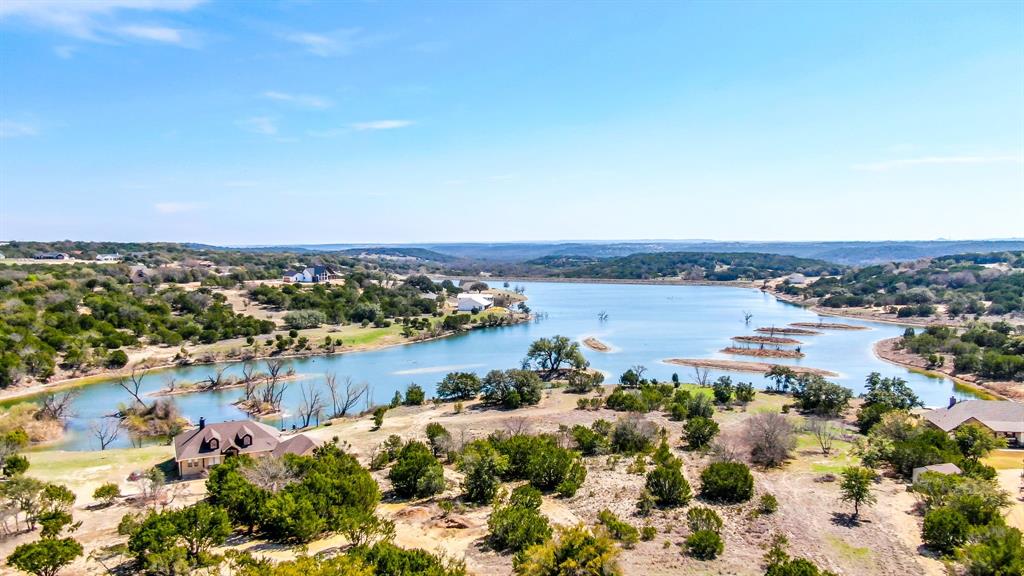 475 Overlook Ridge Bluff Dale, TX 76433 - Photo 22 of 27 a view of a lake with houses