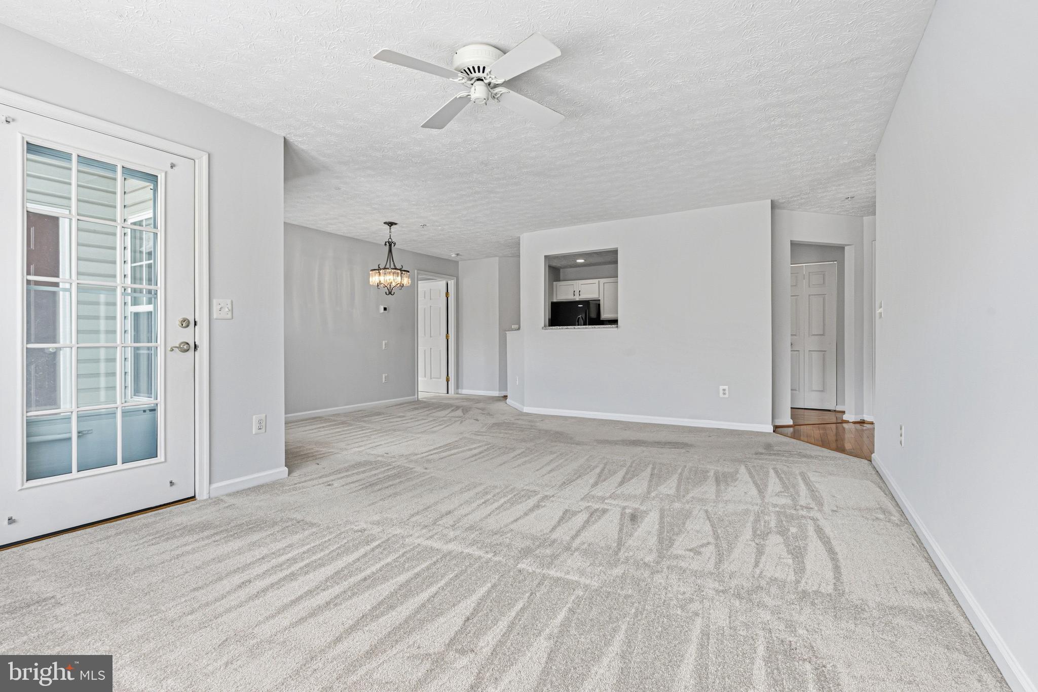 9 Brook Farm Court, Unit 9G Perry Hall, MD 21128 - Photo 18 of 33 a view of empty room with wooden floor and fan