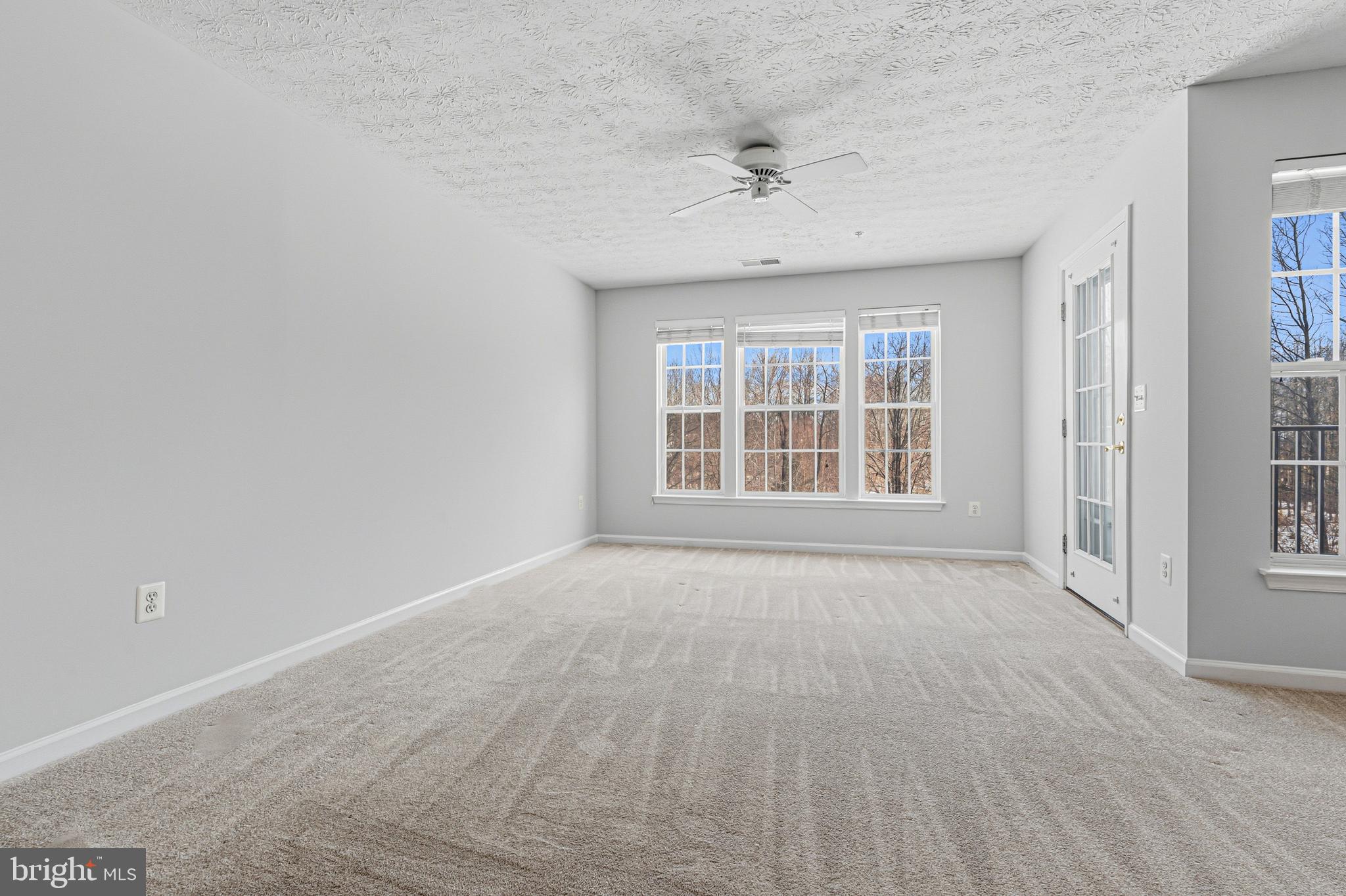 9 Brook Farm Court, Unit 9G Perry Hall, MD 21128 - Photo 21 of 33 a view of an empty room with a window