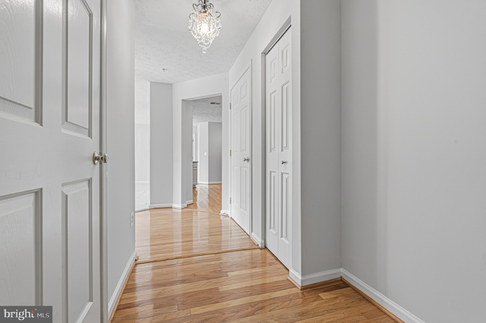 9 Brook Farm Court, Unit 9G Perry Hall, MD 21128 - Photo 5 of 33 a view of a hallway with wooden floor