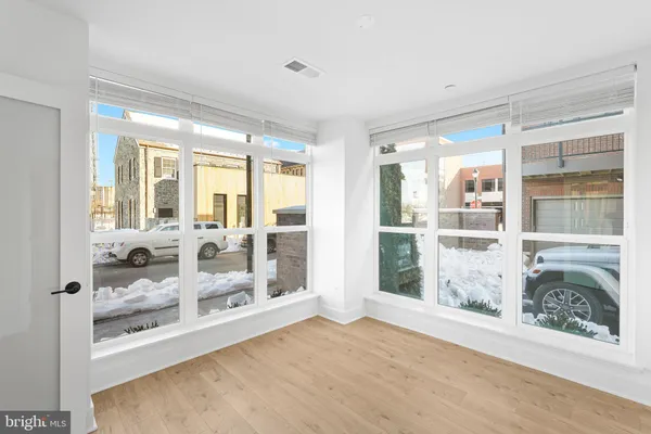 a view of a room with a large window