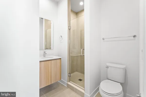 a bathroom with a toilet a sink and shower