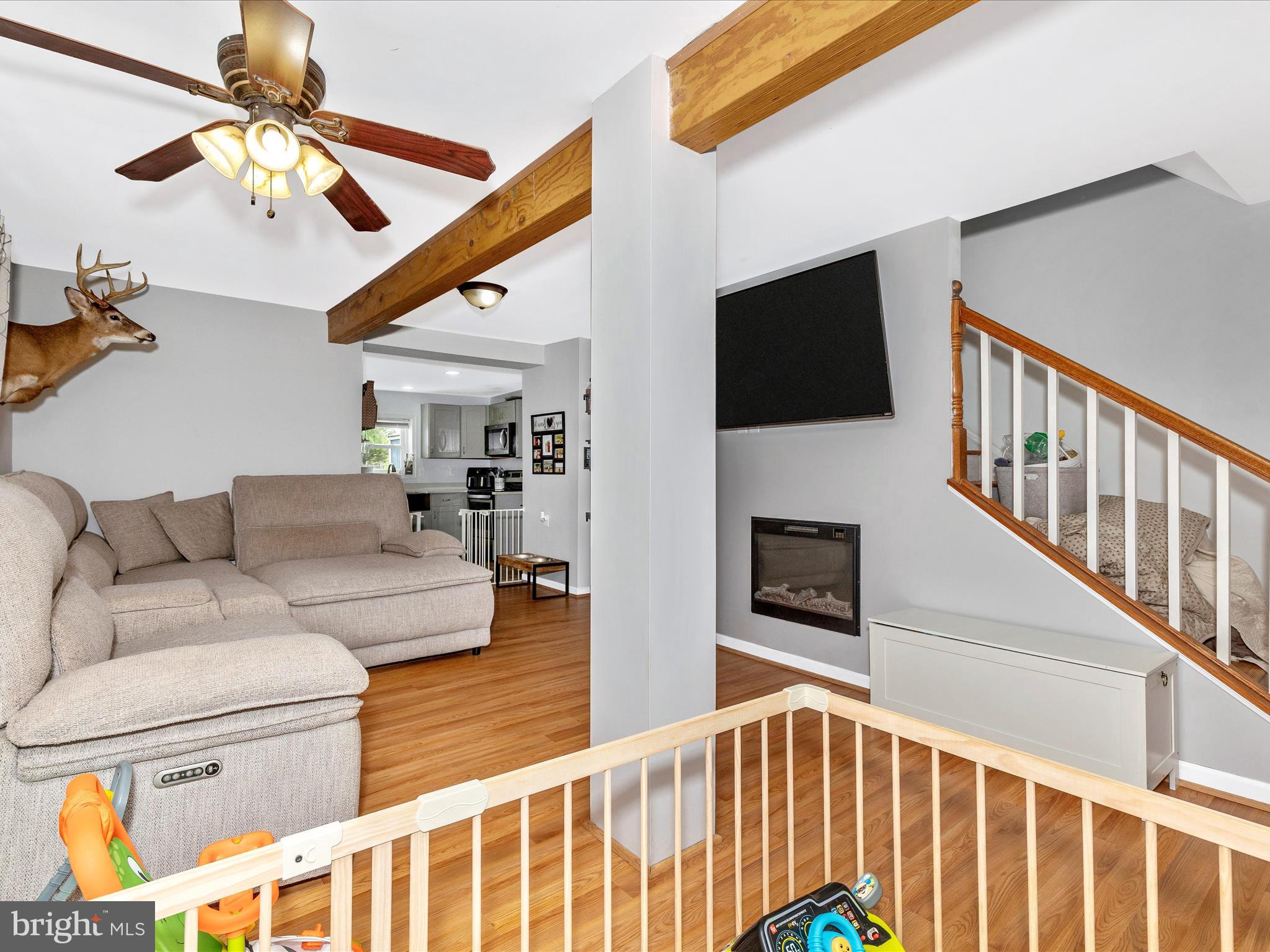 42 Bucher John Road Union Bridge, MD 21791 - Photo 17 of 48 a living room with furniture a flat screen tv and a ceiling fan