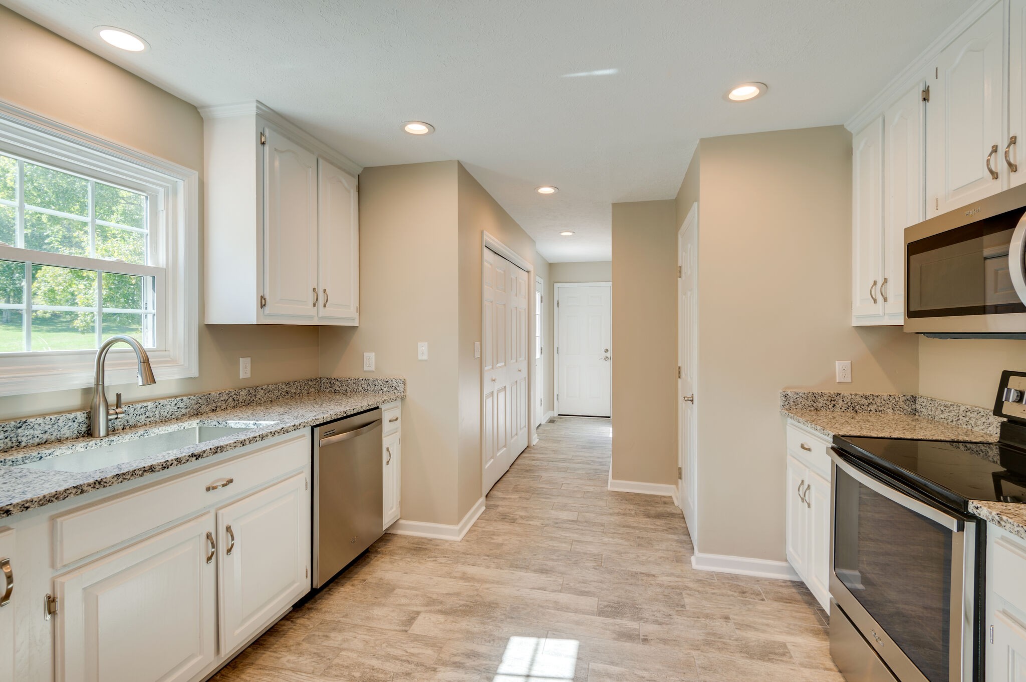 1549 Center Star Road Columbia, TN 38401 - Photo 20 of 50 a kitchen with granite countertop sink stainless steel appliances and cabinets
