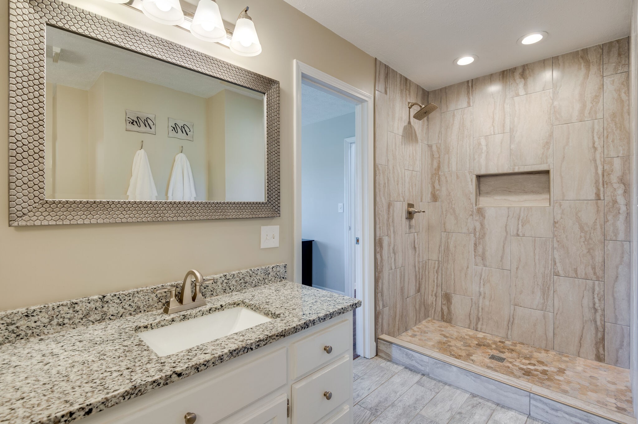 1549 Center Star Road Columbia, TN 38401 - Photo 25 of 50 a bathroom with a granite countertop sink a mirror and a shower