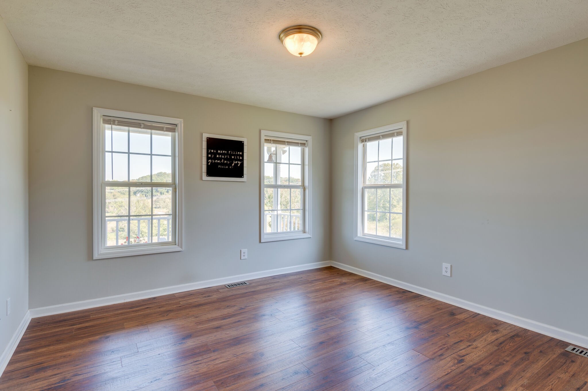 1549 Center Star Road Columbia, TN 38401 - Photo 27 of 50 an empty room with wooden floor and windows