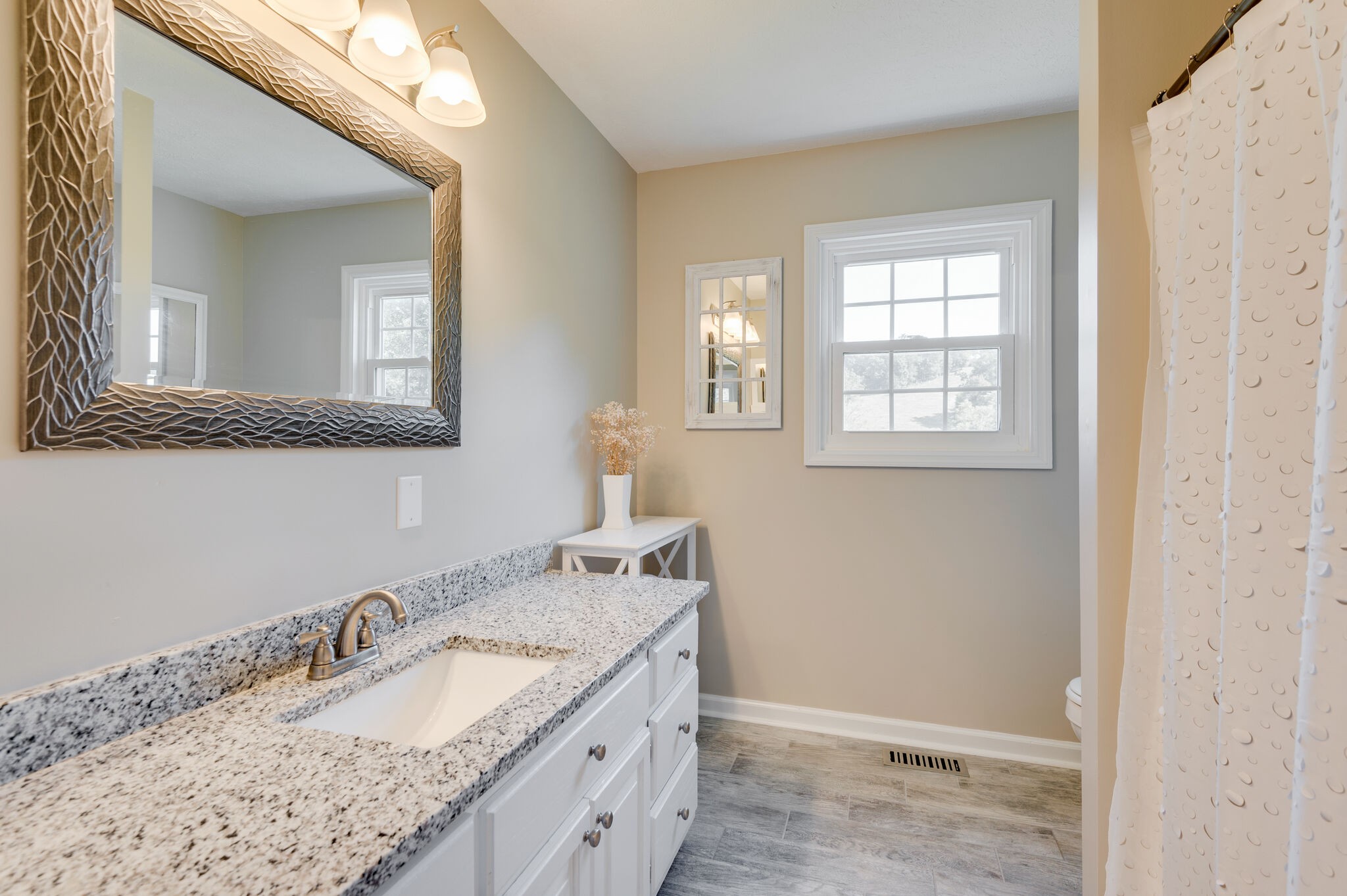 1549 Center Star Road Columbia, TN 38401 - Photo 28 of 50 a bathroom with a granite countertop sink and a mirror
