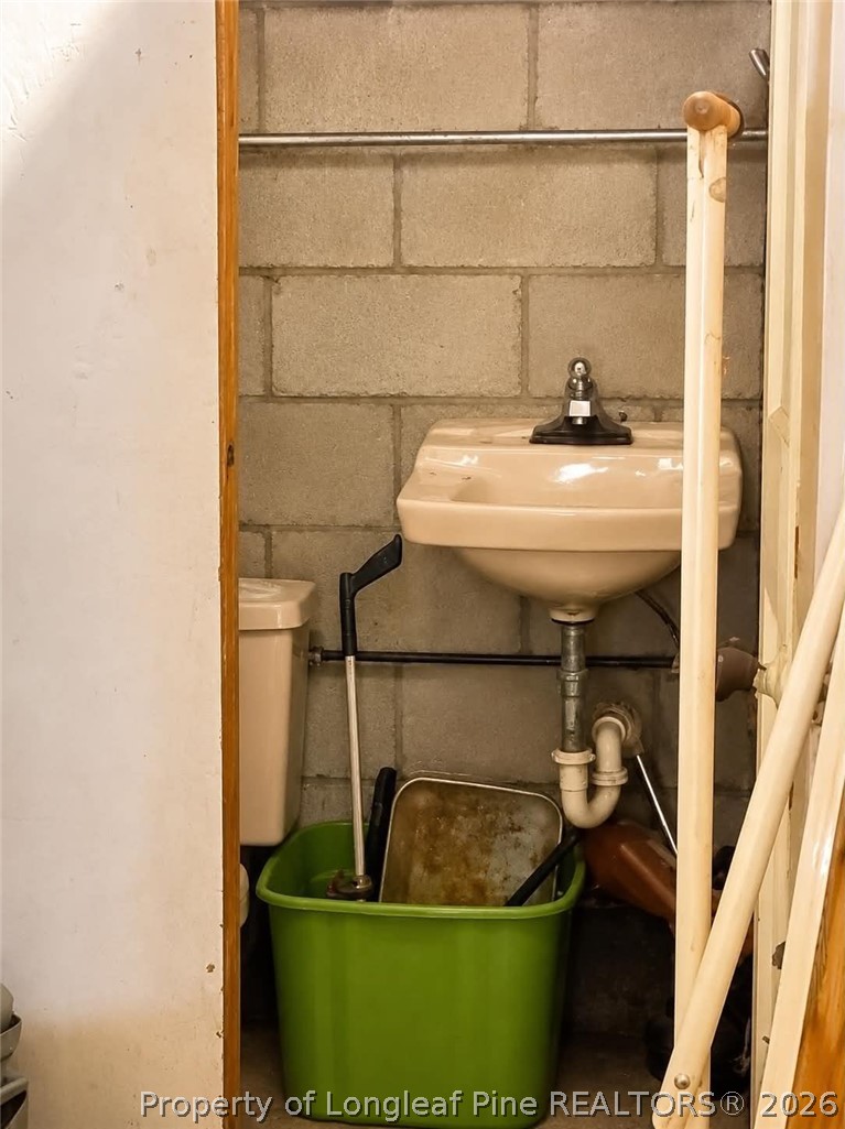 4435 Tartt's Mill Road Wilson, NC 27893 - Photo 23 of 23 a bathroom with a sink and mirror