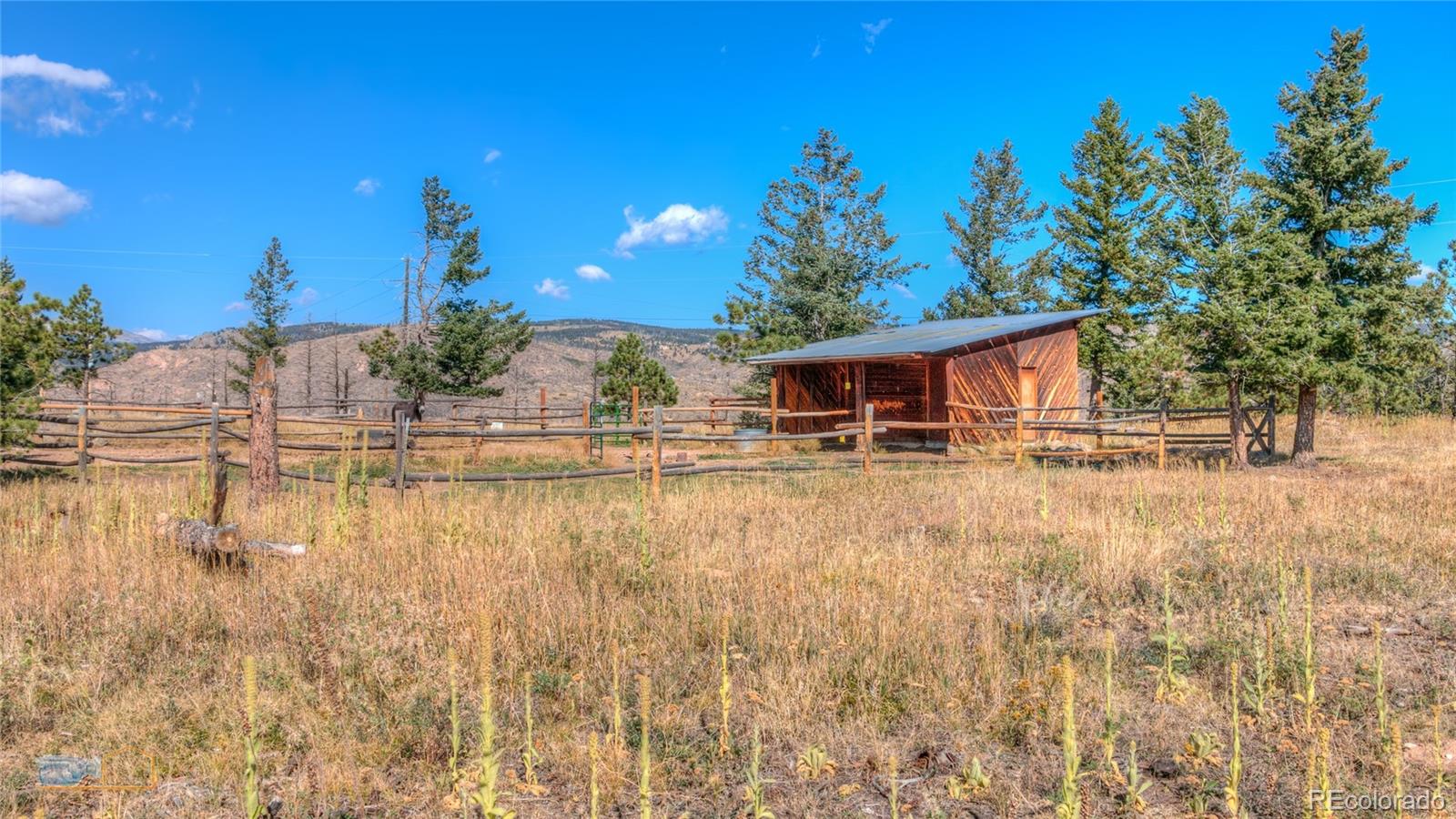 605 Left Fork Road Boulder, CO 80302 - Photo 30 of 35 a front view of a house with a yard