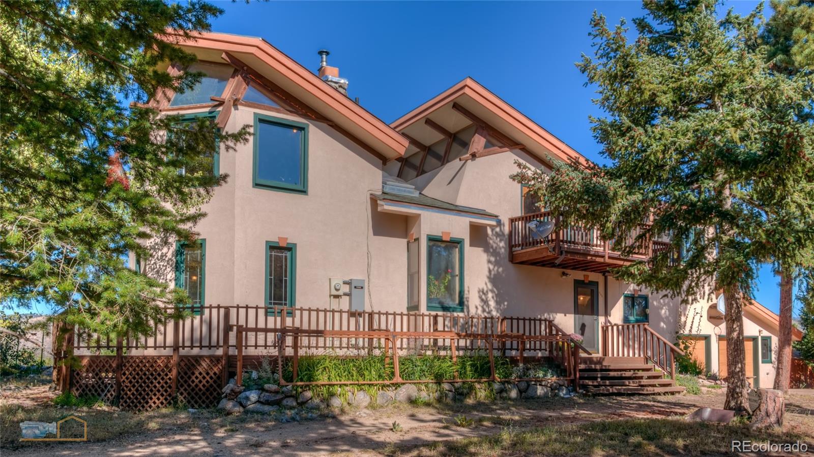 605 Left Fork Road Boulder, CO 80302 - Photo 8 of 35 a front view of a house with a garden
