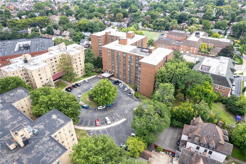 5 Bayard Road, Unit 307 Pittsburgh, PA 15213 - Photo 20 of 20 an aerial view of a house with a yard and lake view in back