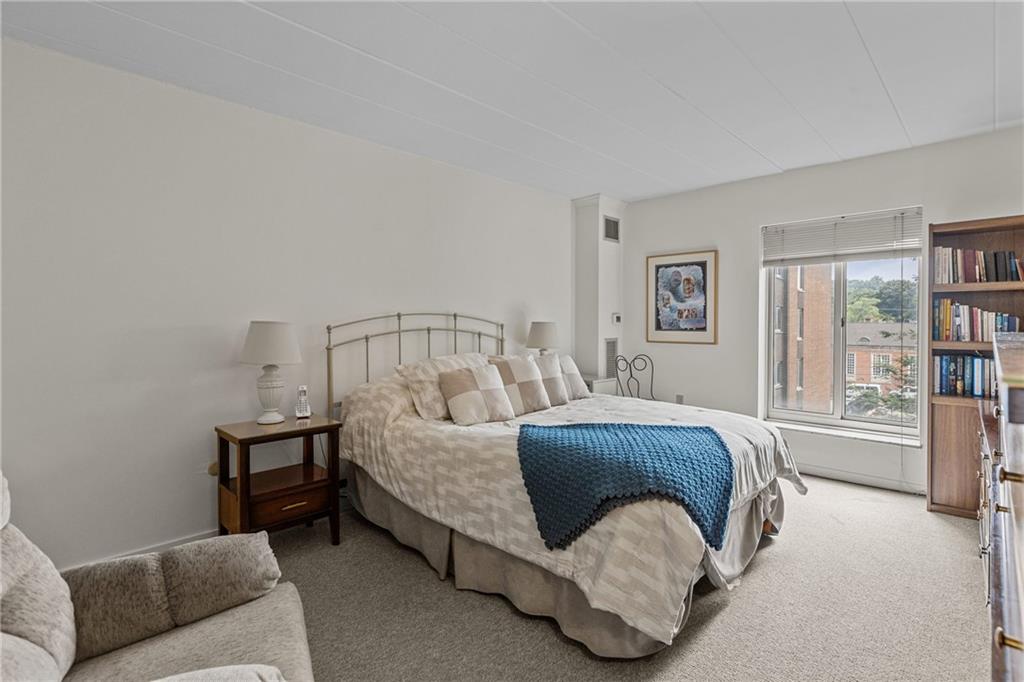 5 Bayard Road, Unit 307 Pittsburgh, PA 15213 - Photo 9 of 20 a bedroom with a bed couch and a window