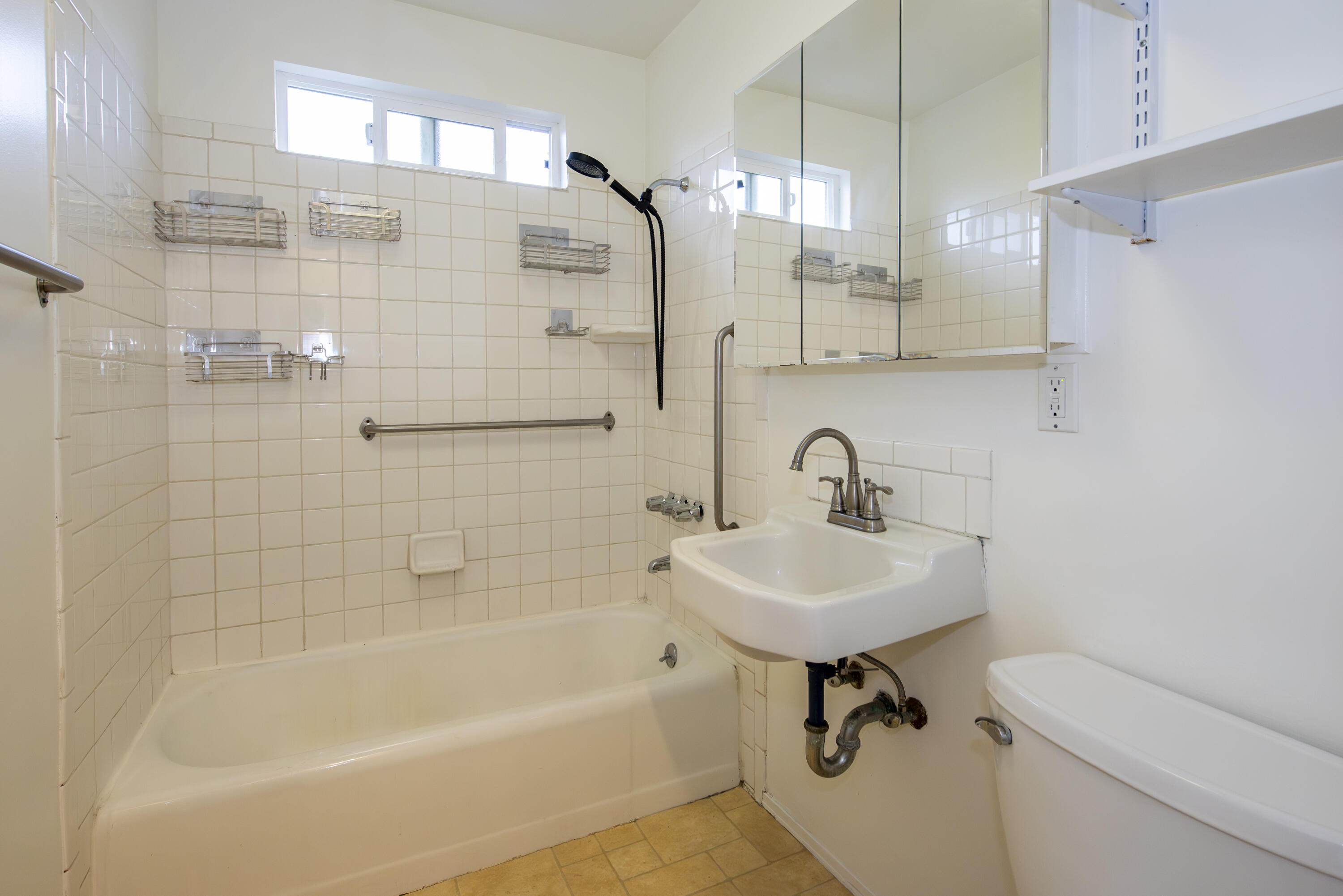 1308 Bath Street Santa Barbara, CA 93101 - Photo 15 of 19 a bathroom with a sink a toilet and a bathtub