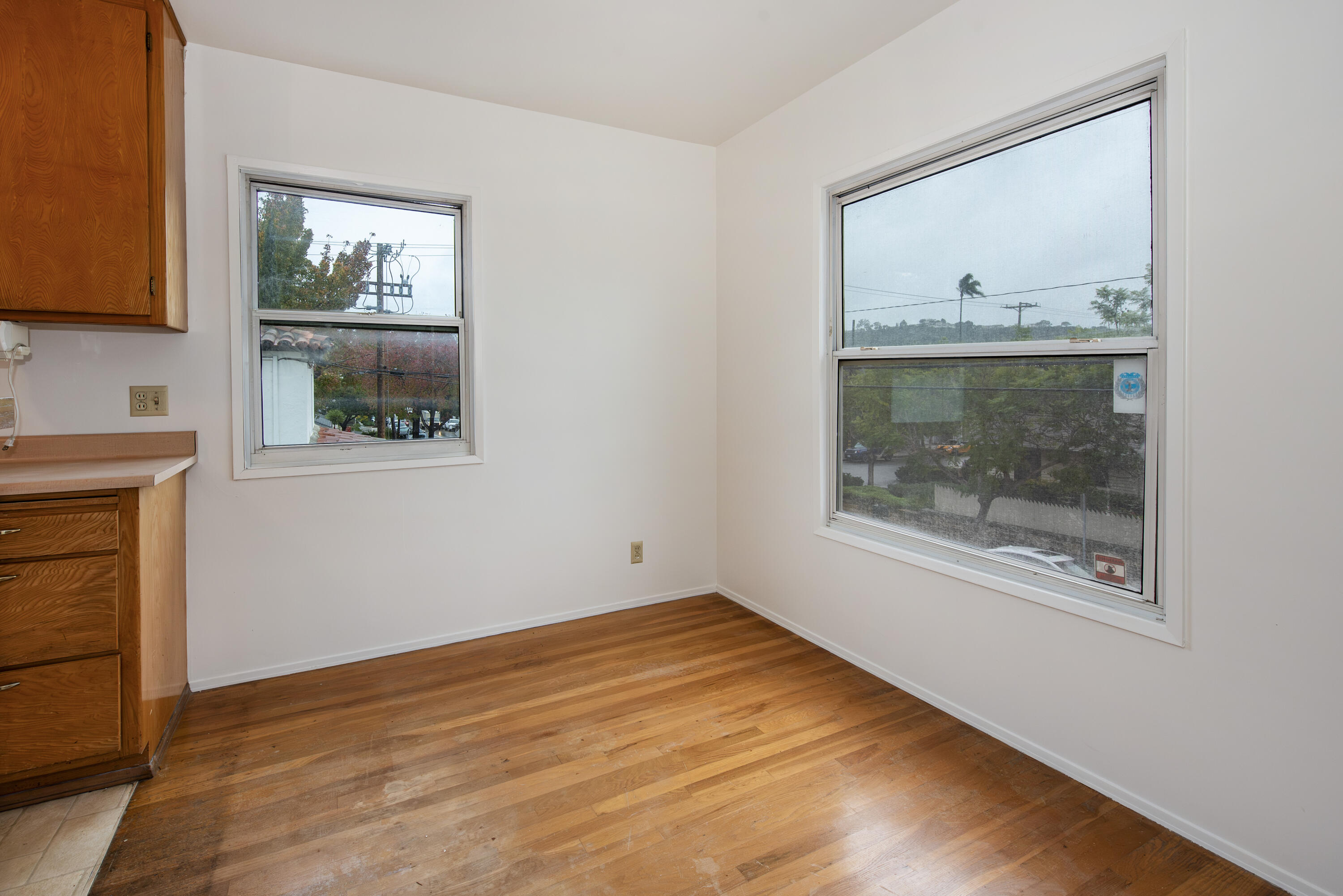 1308 Bath Street Santa Barbara, CA 93101 - Photo 6 of 19 a view of empty room with window and wooden floor