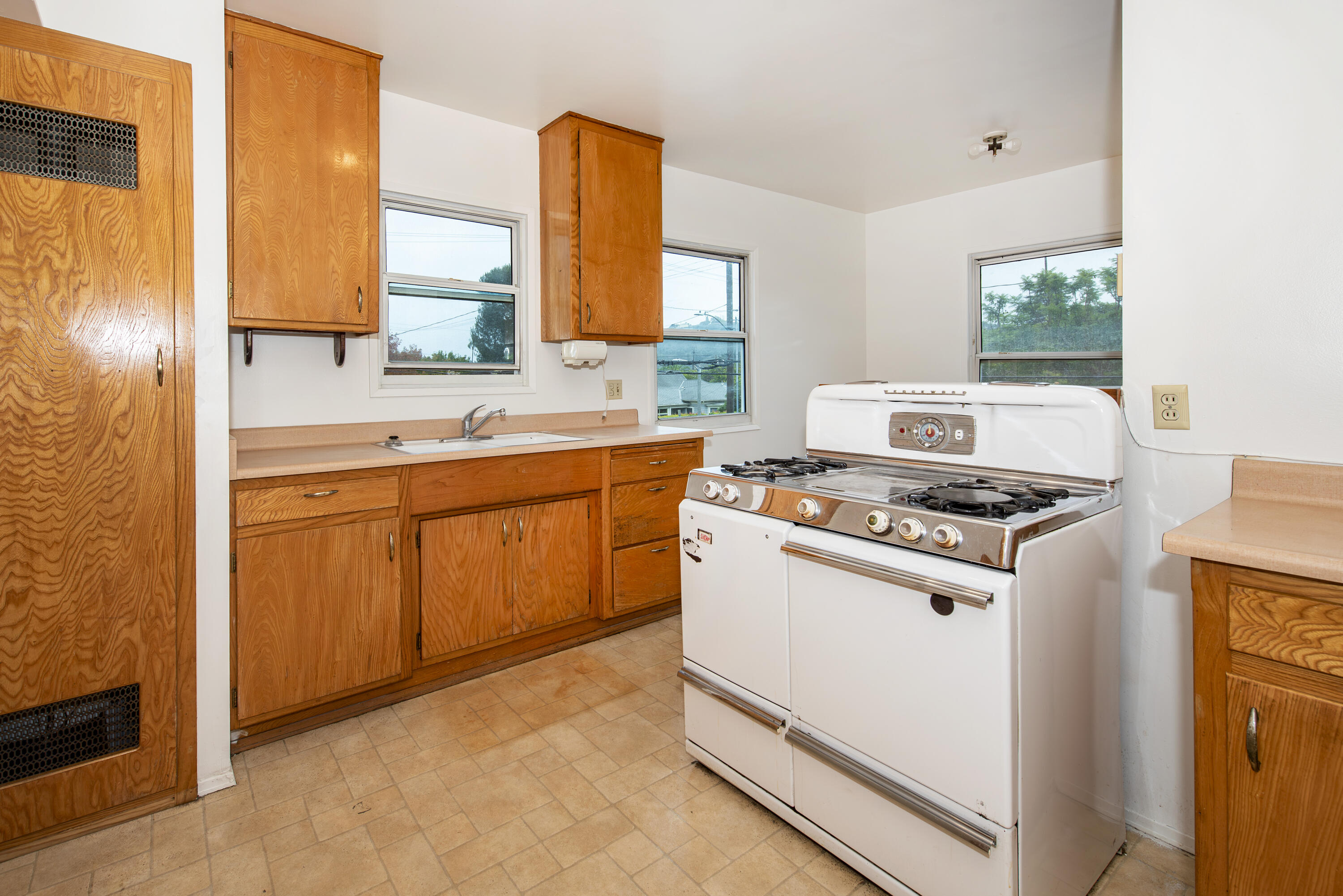 1308 Bath Street Santa Barbara, CA 93101 - Photo 7 of 19 a kitchen with a stove and a sink
