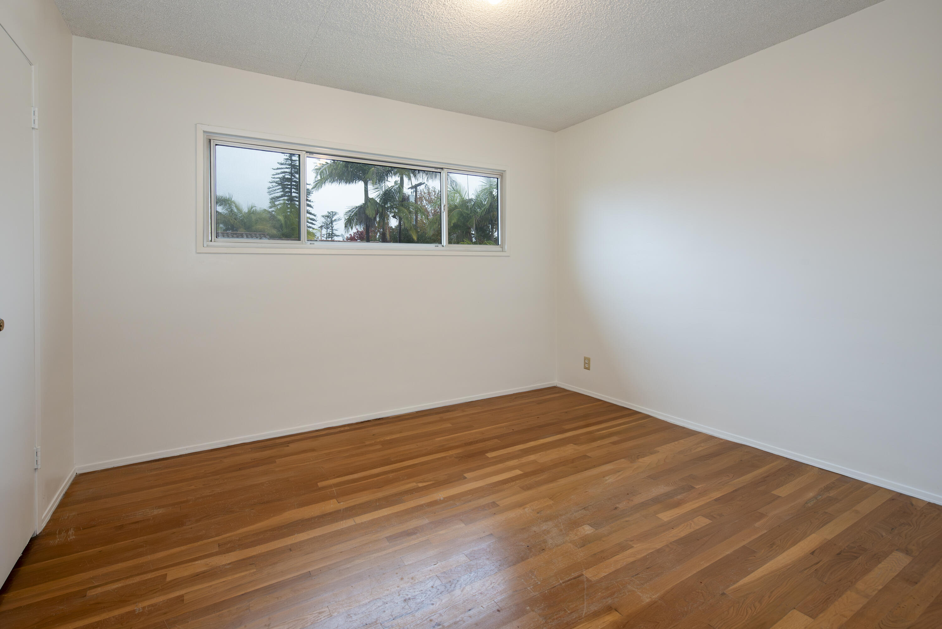 1308 Bath Street Santa Barbara, CA 93101 - Photo 8 of 19 a view of empty room with wooden floor
