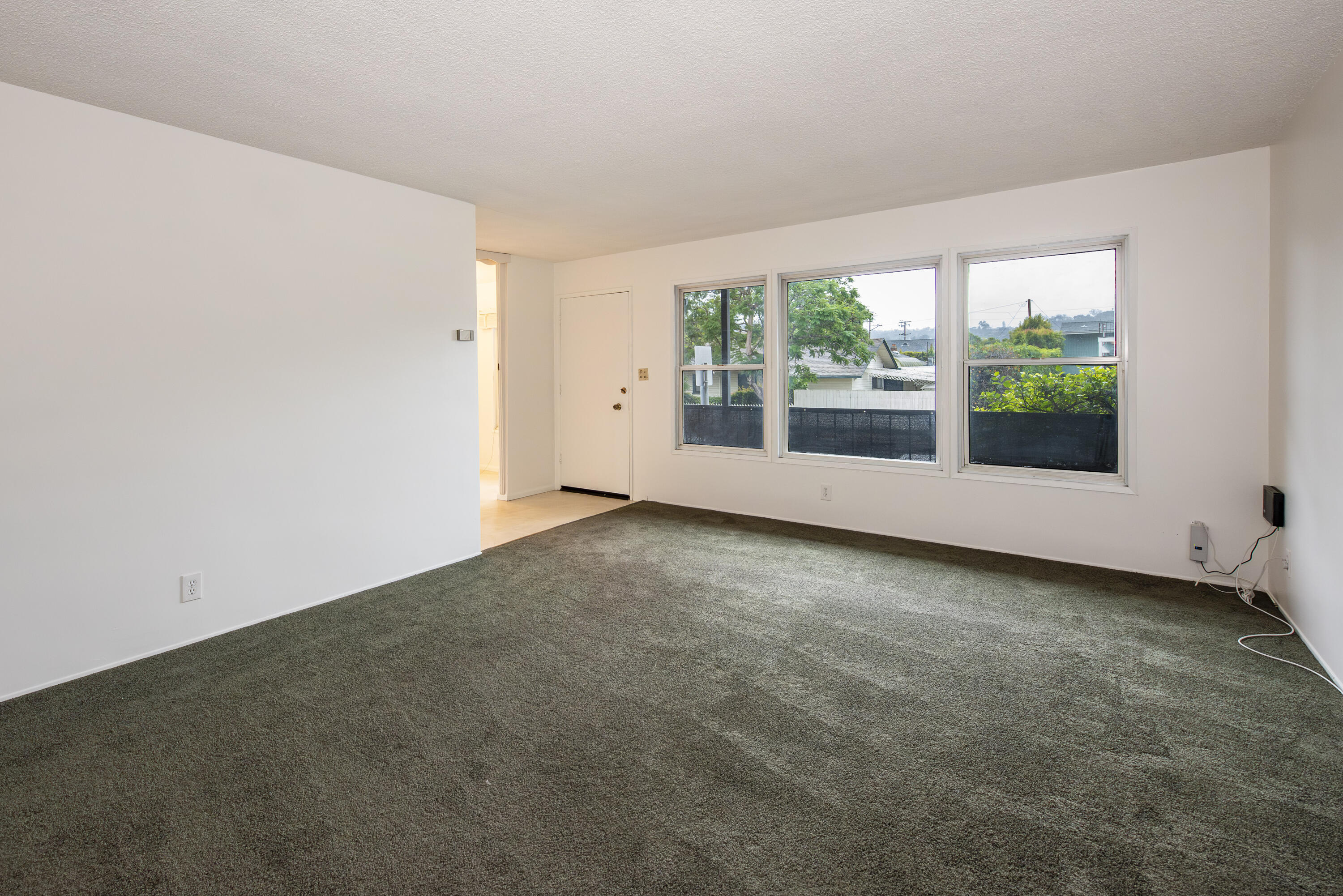 1308 Bath Street Santa Barbara, CA 93101 - Photo 10 of 19 an empty room with an outdoor view and a window