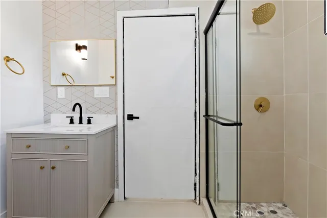 a bathroom with a sink and mirror