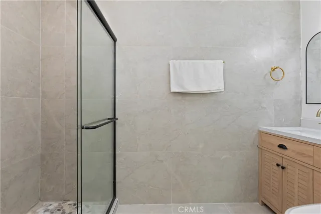 a bathroom with a shower and a sink