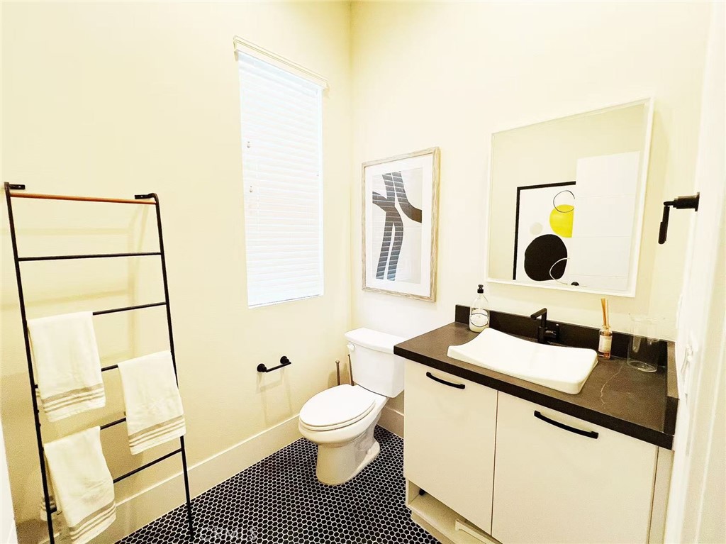 753 Site Drive Brea, CA 92821 - Photo 13 of 28 a bathroom with a sink toilet a mirror and vanity