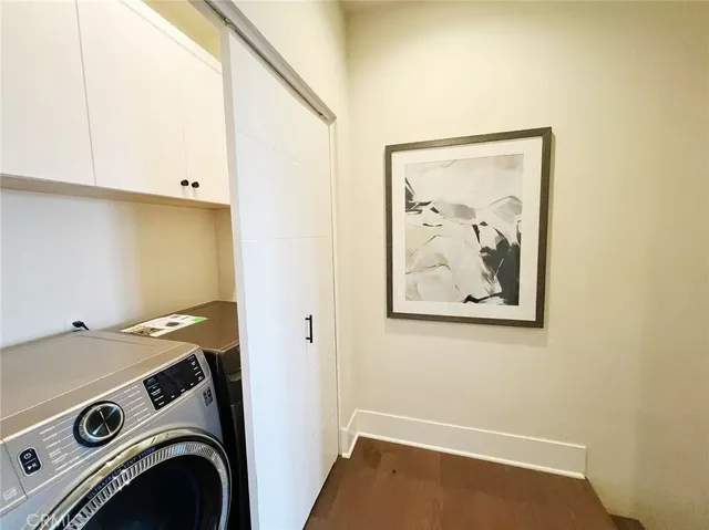 a view of storage and utility room with washer and dryer