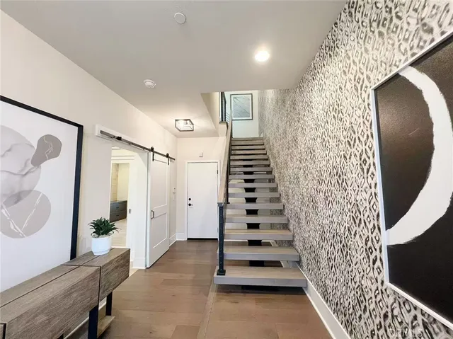 a view of entryway with wooden floor