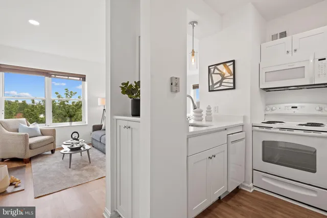 a kitchen with stainless steel appliances granite countertop a stove and a sink