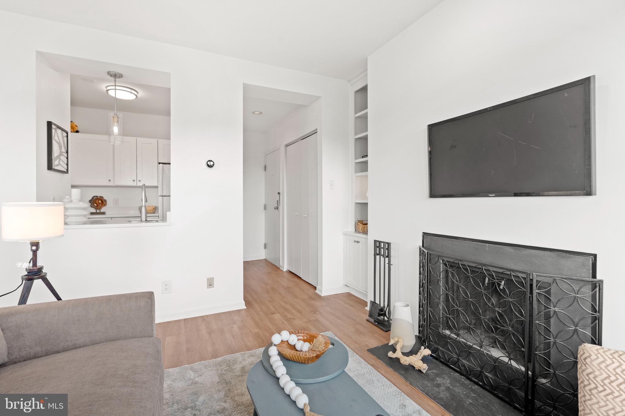 1736 Willard Street Northwest, Unit 506 Washington, DC 20009 - Photo 11 of 28 a living room with furniture and a flat screen tv