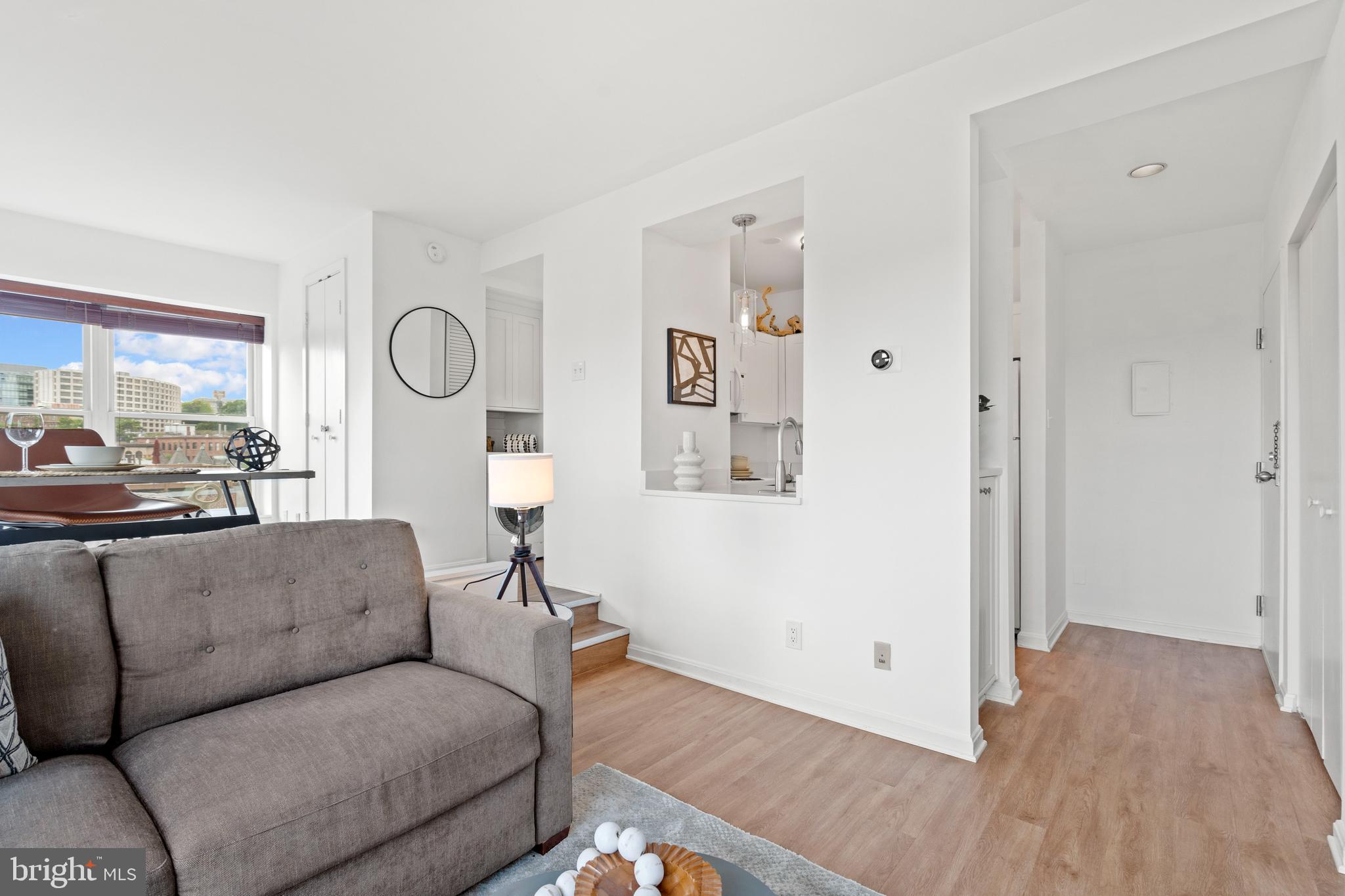 1736 Willard Street Northwest, Unit 506 Washington, DC 20009 - Photo 12 of 28 a living room with furniture and a window