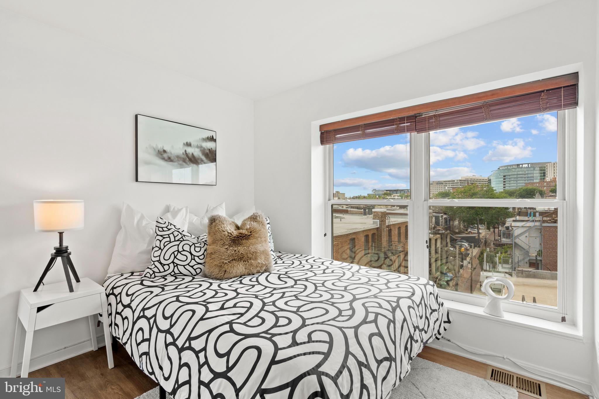 1736 Willard Street Northwest, Unit 506 Washington, DC 20009 - Photo 16 of 28 a bedroom with a large bed and a large window
