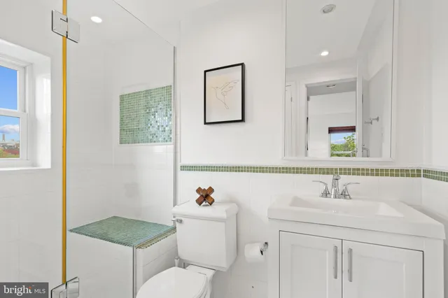 a bathroom with a shower and a sink