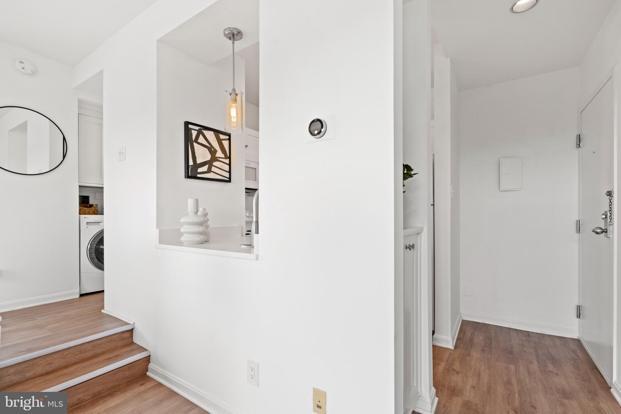 1736 Willard Street Northwest, Unit 506 Washington, DC 20009 - Photo 8 of 28 a view of a hallway with wooden floor and staircase