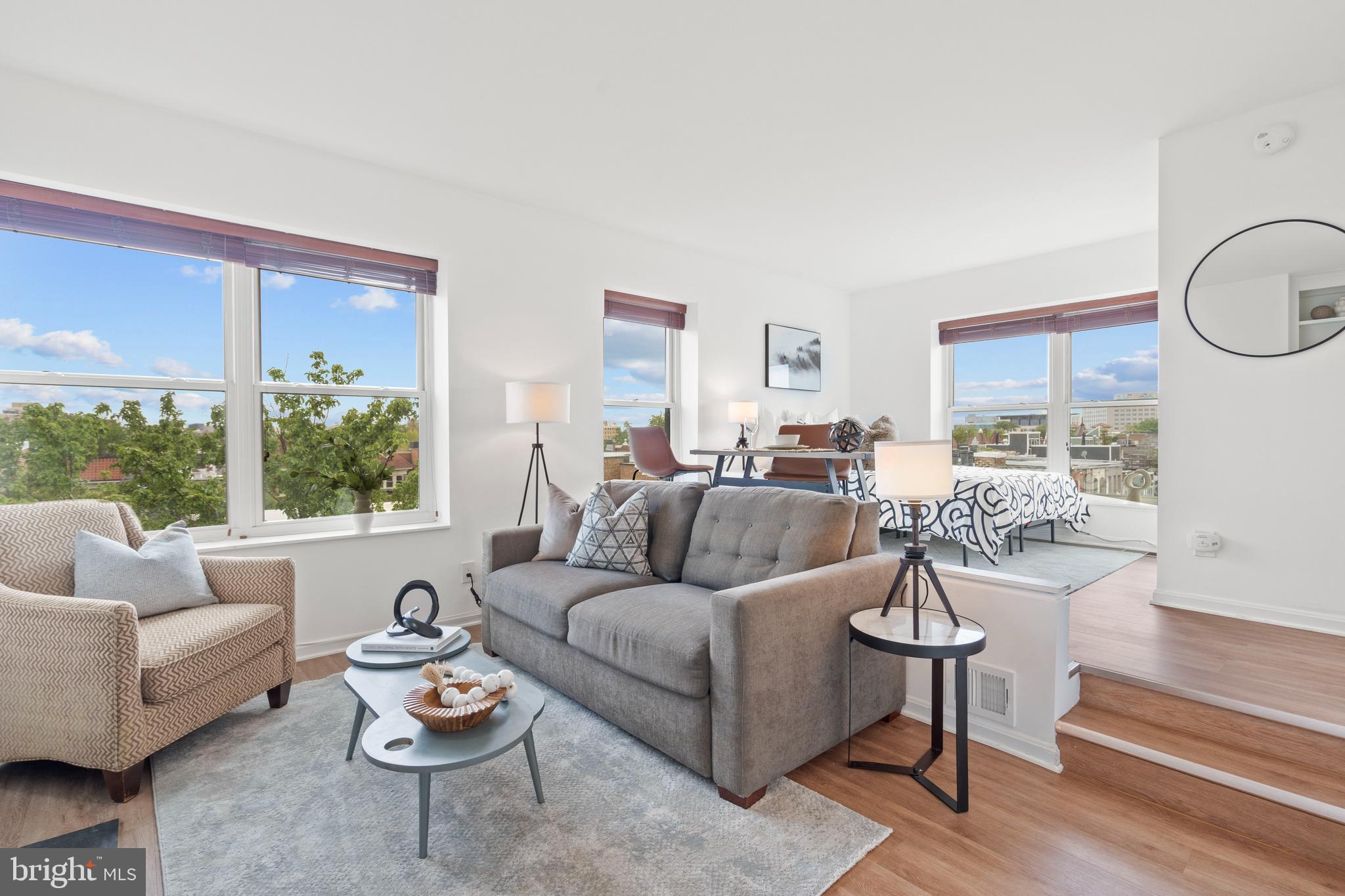 1736 Willard Street Northwest, Unit 506 Washington, DC 20009 - Photo 9 of 28 a living room with furniture and a large window