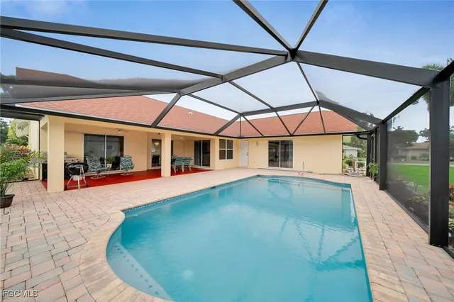 a view of swimming pool with seating area