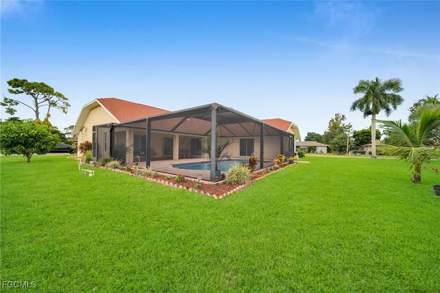a view of a house with a yard porch and sitting area